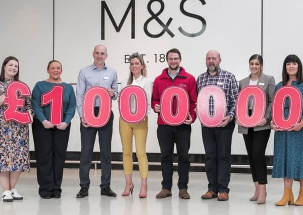 Celebrating the milestone fundraising figure is (l-r) Holly O'Hagan, Martina McNulty and Simon Layton (M&S), Lucy McCusker and Mark Jones (Action Cancer) and Stephen Hilland, Ellen Watters and Imelda Smyth (M&S).