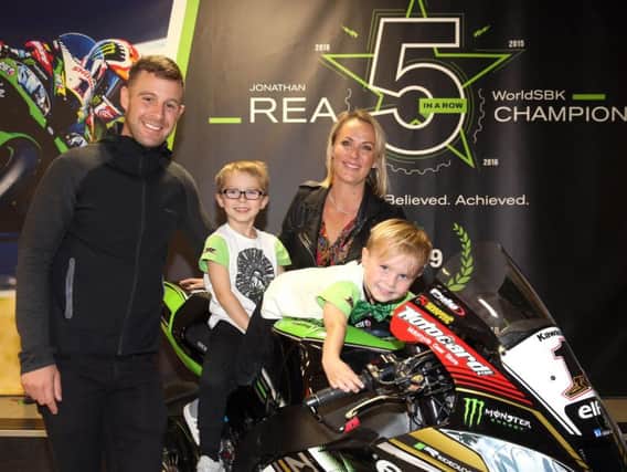 World Superbike champion Jonathan Rea with his wife Tatia, and children Jake and Tyler after he arrived back to Northern Ireland at Belfast International Airport on Wednesday.