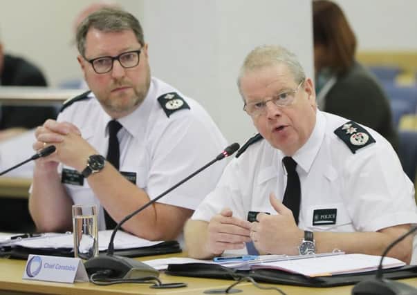 PSNI Chief Constable Simon Byrne (right) and Deputy Chief Constable Stephen Martin address the Northern Ireland Policing Board in Belfast