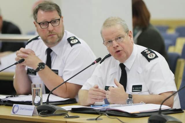 (left to right) PSNI Deputy Chief Constable Stephen Martin and Chief Constable Simon Byrne address the Northern Ireland Policing Board in Belfast.