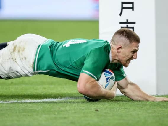 Ireland's Andrew Conway goes over for the crucial bonus point securing fourth try against Russia