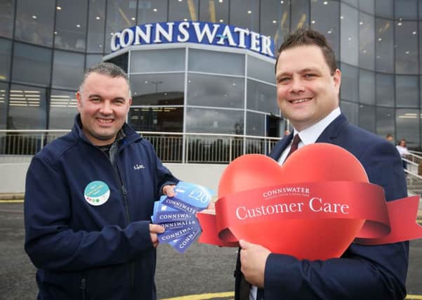 Connswater Shopping Centre manager Mark Rainey rewards David Vance from Lidl with £100 of gift vouchers and a customer care award after his recent act of kindness paying for a customer's shopping who was having difficulty paying. 
Picture by Matt Mackey / Press Eye