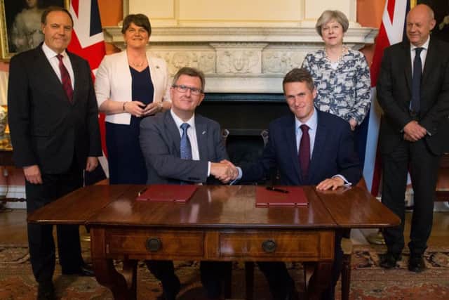 DUP leader Arlene Foster, then Prime Minister Theresa May, Sir Jeffrey Donaldson and Tory chief whip Gavin Williamson agree a deal in Downing Street in June 2017. Sir Jeffrey says that while this deal secured things for Northern Ireland, the UUP-Tory Ucunf deal did not. Photo: Daniel Leal-Olivas/PA