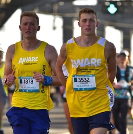 Peter (left) and his brother James running the Sydney Marathon