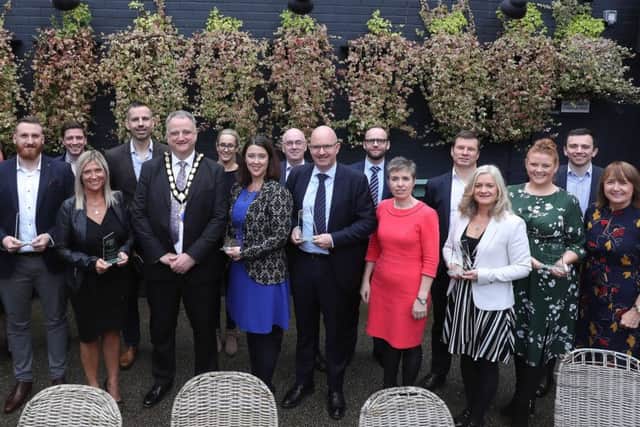 Winners and Highly Commended businesses from the Northern Ireland Chamber of Commerce and Industrys annual Chamber Business Awards are pictured receiving their awards from NI Chamber President, John Healy.