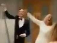 The newlyweds appear to be chanting 'f**k the Pope and the I.R.A.' as they enter the function room.