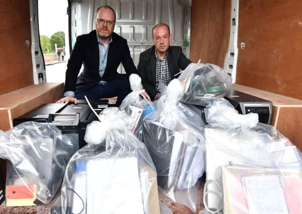 Trevor Birney and Barry McCaffrey collecting their materials at Castlereagh police station in June this year