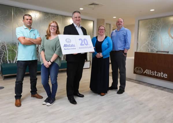 John Healy, Vice President and Managing Director of Allstate Northern Ireland (centre) celebrating the company's 20th anniversary with staff who have twenty years of continuous service. L-R Mark Lilburn, Pauline Lilburn, Jayne Workman, Paddy Warnock