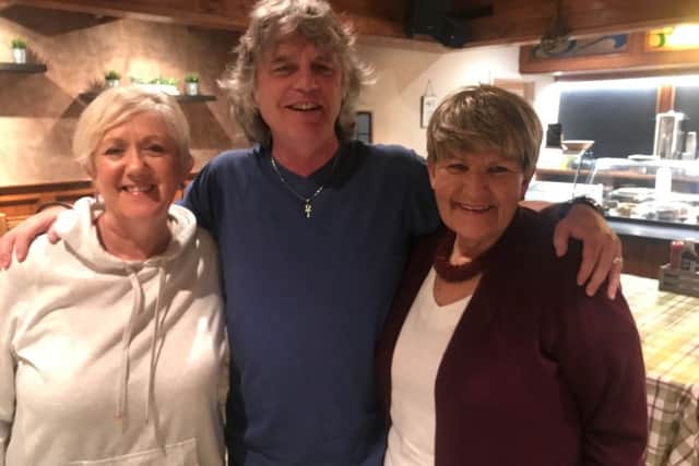 Damian Gorman with Portavogie residents Carole Gilmore and Elaine McFeeters during filming for A Quare Tongue