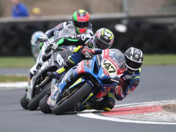 Richard Cooper (Buildbase Suzuki) leads Danny Buchan (FS-3 Kawasaki) and Michael Laverty (Tyco BMW) in the Sunflower Trophy race at Bishopscourt in 2018.