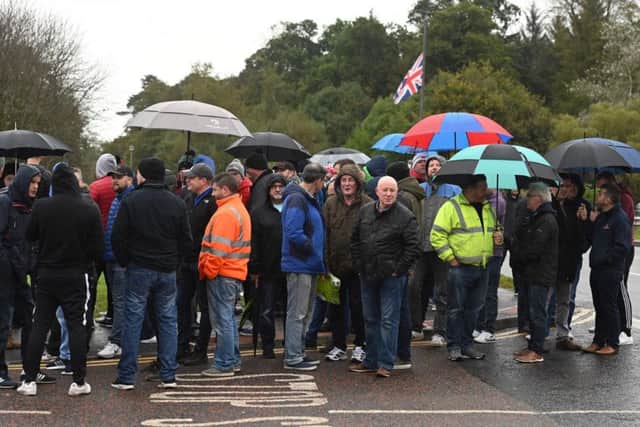 Wrightbus workers gathered outside the plant on Thursday morning awaiting news of a possible deal. Pic: Colm Lenaghan/Pacemaker
