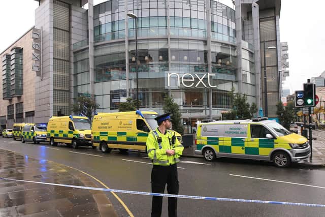 A police officer and ambulances outside the Arndale Centre in Manchester where at least five people have been treated after a stabbing incident. (Photo: Peter Byrne/P.A. Wire)