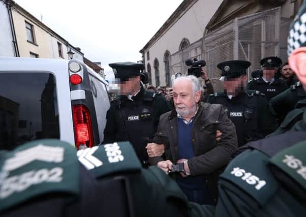 John Downey, who is facing prosecution for the murder of two soldiers in Northern Ireland, is taken from Omagh Magistrates' Court. PA Photo. Picture date: Saturday October 12, 2019.. Photo credit: Nial Carson/PA Wire