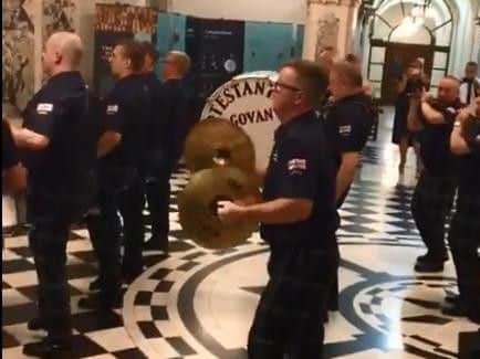 A picture from footage of Govan Protestant Boys appearing to play in Belfast City Hall