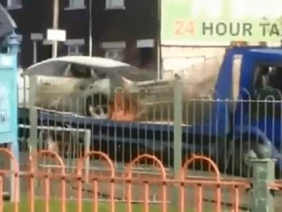 A still image taken from the video of a car catching fire in Northern Ireland. (Video courtesy of Cop/VOSA Watch Derry.