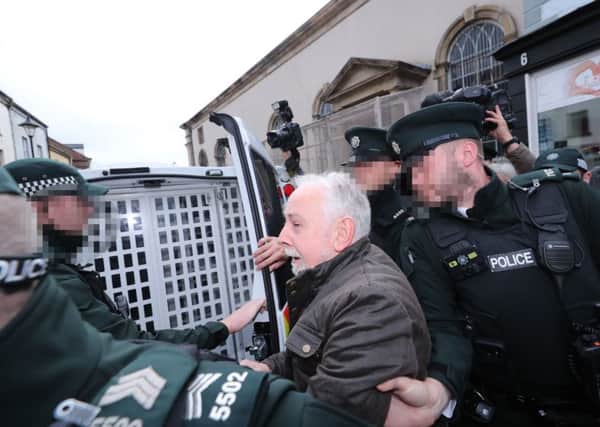 John Downey, who is facing prosecution for the murder of two soldiers in Northern Ireland is taken from Omagh Magistrates' Court in Omagh last Saturday, where he was refused bail due to the judge's assessment that he may be a flight risk. Photo: Nial Carson/PA Wire