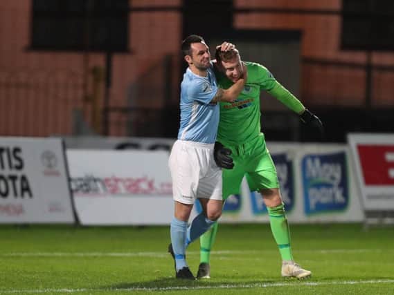 Ballymena United captain Jim Ervin celebrates with goalkeeper Jordan Williamson after their penalty shoot-out win over Crusaders