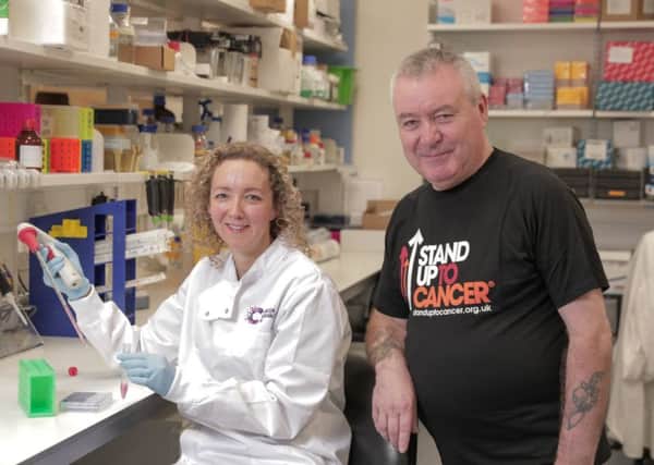 Belfast scientist Dr Vicky Coyle with bowel cancer survivor Robert McCartney from Woodvale in Belfast