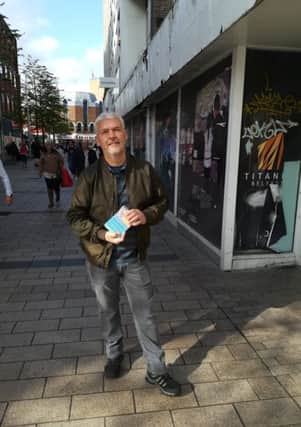 Hugh McIlveen handing out religious tracts in Belfast's Cornmarket