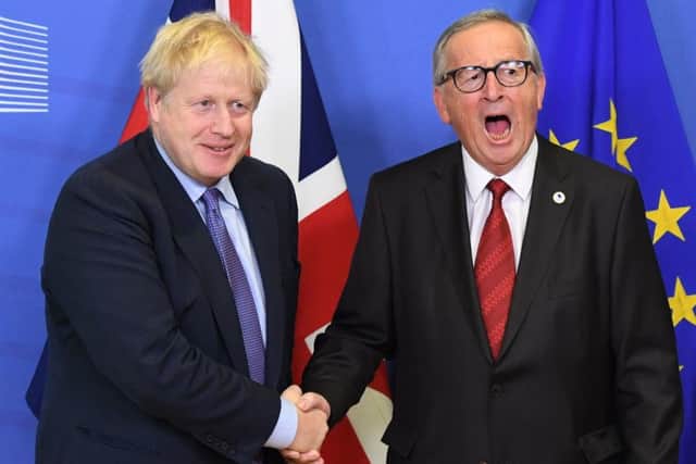 Prime Minister Boris Johnson and Jean-Claude Juncker, President of the European Commission, ahead of the opening sessions of the European Council summit at EU headquarters in Brussels on Thursday. (Photo: P.A. Wire/Stefan Rousseau)