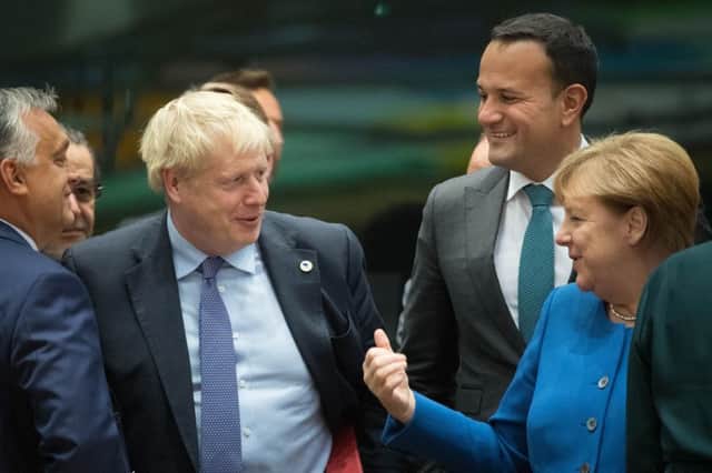 Prime Minister Boris Johnson (centre left) with Taoiseach Leo Varadkar (2nd right) and Chancellor of Germany Angela Merkel at a round table for the European Council summit at EU headquarters in Brussels. PA Photo. Picture date: Thursday October 17, 2019. See PA story POLITICS Brexit. Photo credit should read: Stefan Rousseau/PA Wire