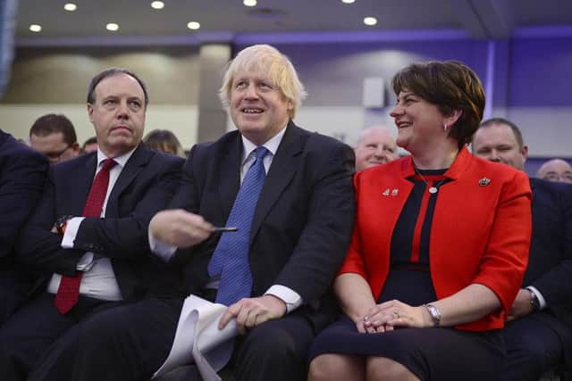 Boris Johnson (centre) pictured at the DUP annual conference in November 2018 - included is Nigel Dodds MP and Arlene Foster DUP leader and MLA. (Photo: Pacemaker)