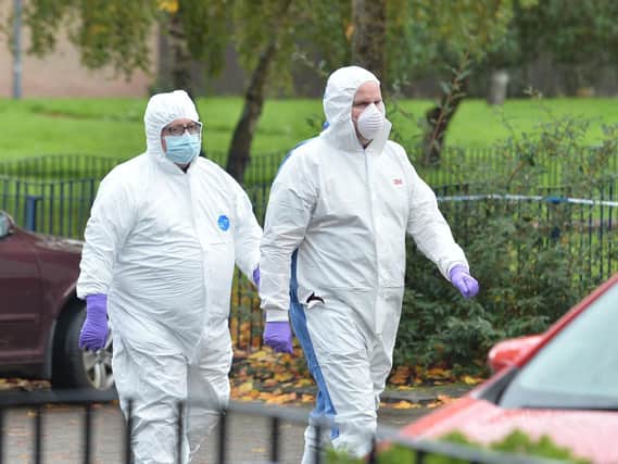 PSNI forensic officers arrive at the scene in east Belfast. (Photo: Pacemaker)
