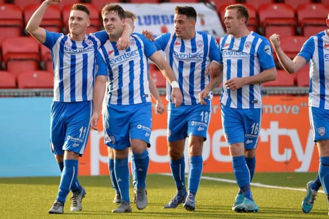 Coleraine celebrate Ben Doherty's second penalty of the day