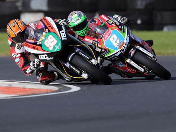 Jeremy McWilliams (KMR Kawasaki) leads Glenn Irwin (Burrows Engineering Kawasaki) in the Supertwin class at the Sunflower Trophy meeting iat Bishopscourt in 2018.