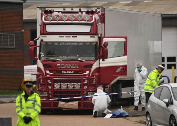 Police and forensic officers activity at the Waterglade Industrial Park in Grays, Essex, after 39 bodies were found inside a lorry. PA Photo.