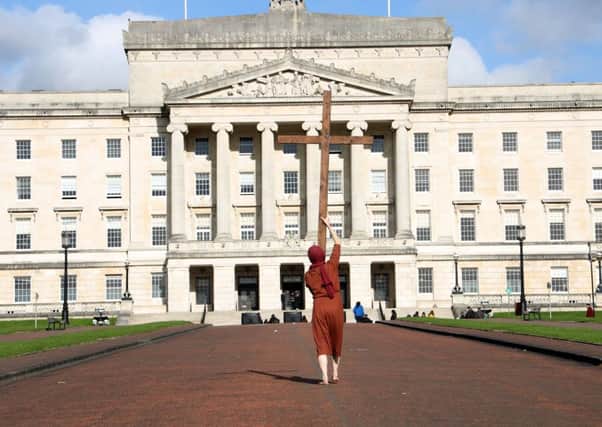 An anti-abortion protestor walks with a cross on Monday at Stormont as the assembly sat for the first time in nearly three years after being recalled in a last-ditch attempt to stop abortion law changes. 
Photo Laura Davison/Pacemaker Press