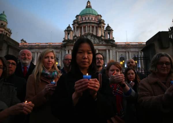 Vigil held at Belfast City Hall for the 39 people who were found dead in a lorry trailer yesterday in Essex. Rebecca Ng from the Chinese Welfare Association NI leads the vigil. 

Picture: Jonathan Porter/PressEye