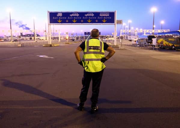 UK Border Agency staff at the ferry port in Calais, France, as the deaths of 39 people found in a lorry container in the UK have sparked concerns about the checks on vehicles entering the country. Photo: Gareth Fuller/PA Wire