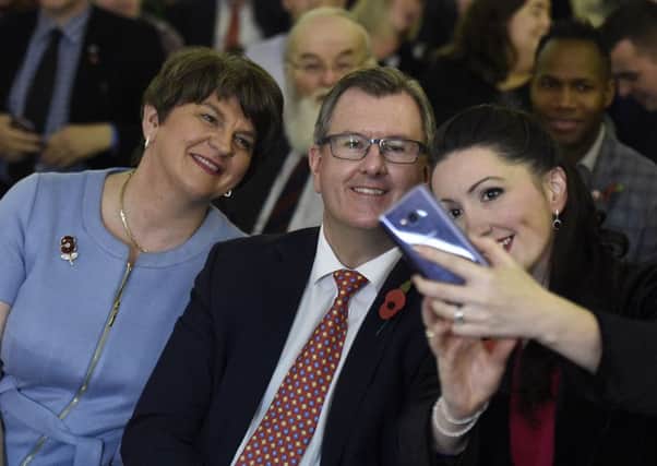 Arlene Foster and Sir Jeffrey Donaldson pose for a selfie with Emma Little-Pengelly at the DUP conference in Belfast on Saturday
