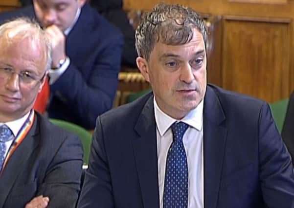Northern Ireland Secretary Julian Smith appearing before the NI Affairs Select Committee in the House of Commons, alongside NIO permanent secretary Jonathan Stephens, left, on October 23, 2019. Photo: PA Wire