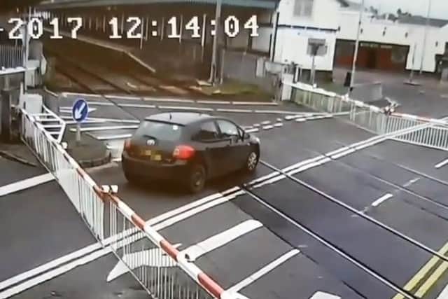 Driver ignoring warnings at a level crossing