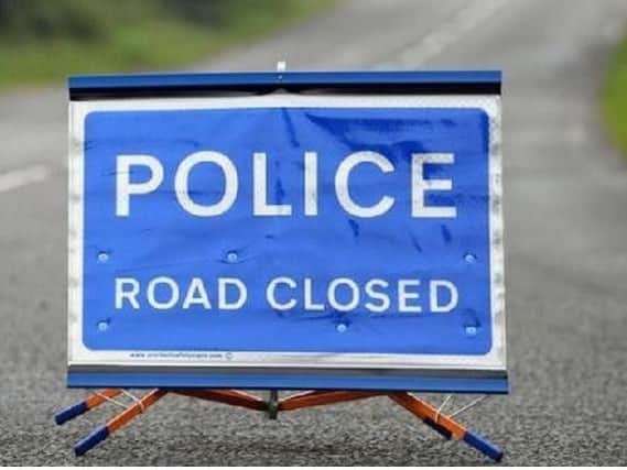 The PSNI has closed the road after a suspicious object was discovered in the area.