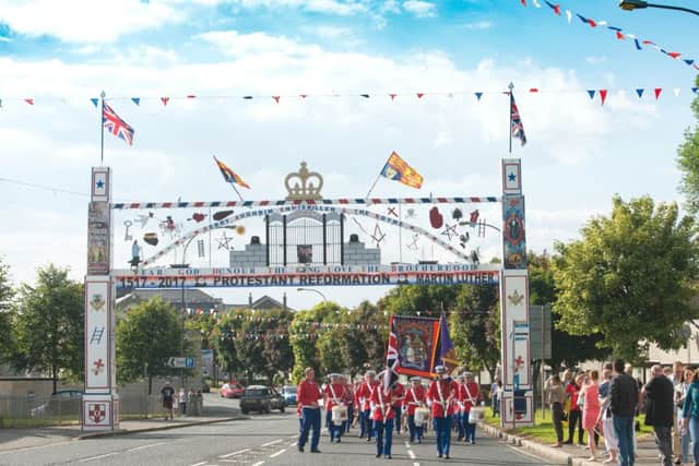 Bandsmen pass Queen Street Orange Arch in 2017