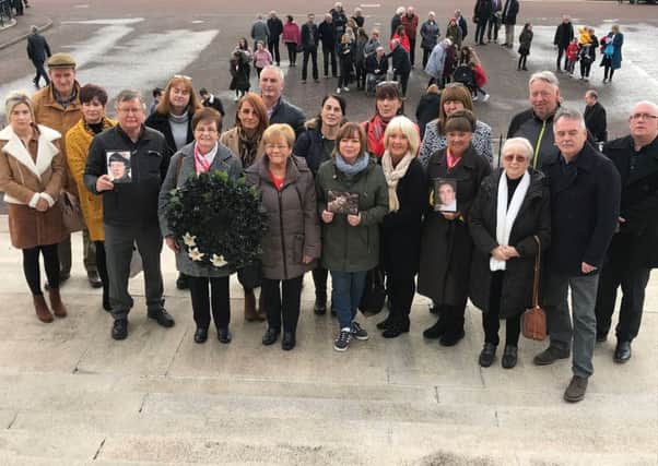 Families of 16 people killed and secretly buried by republicans during the Troubles take part in the 13th annual All Souls Silent Walk at Stormont