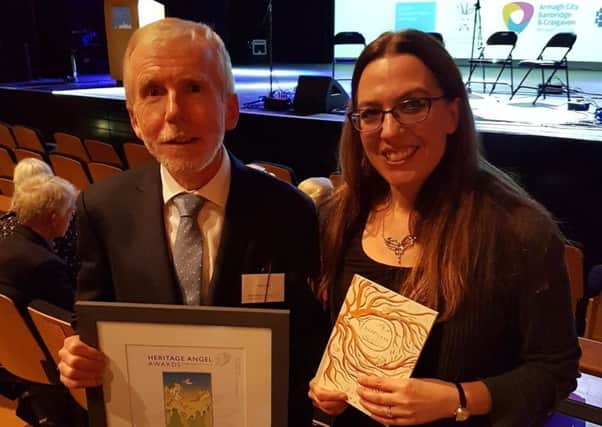 Peter Lant, Education Officer, Hill of the ONeill and Ranfurly House with Myra Zepf, Childrens Writing Fellow for Northern Ireland (2017-19) at the Ulster Architectural Heritage Awards, with the award for the Best Contribution to a Heritage Project by Young People on behalf of the Heartland project.