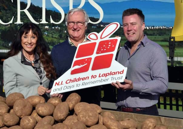 Pictured are Fiona Williamson, co-ordinator, NI Children to Lapland and Days To Remember Trust; Colin Barkley, the charity's chair; and Michael McKillop, Managing Director, Glens of Antrim Potatoes
