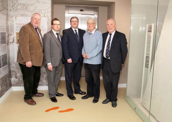 From left, Rev Mervyn Gibson, Orange Order grand secretary, Dr Andrew Charles, Friends of Schomberg House, Jonathan Mattison, museum curator, Sam Wilson, former owner, and Desmond Brownlie, Friends of Schomberg House, at the launch of the tablecloth
