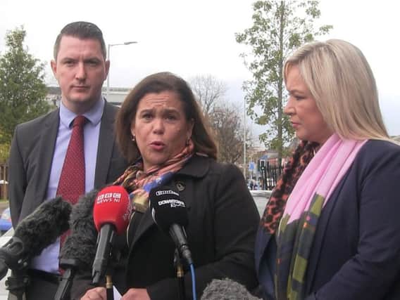 Sinn Fein President Mary Lou McDonald, flanked by North Belfast candidate John Finucane and party vice president Michelle O'Neill, speaks to the media outside Sinn Fein's offices on Falls Road in Belfast, as she announces her party's decision to stand aside in three constituencies in Northern Ireland. (Photo: David Young/PA Wire)