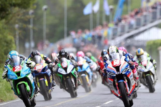 Peter Hickman (60) and Dean Harrison (2) lead the Superstock race away at this year's Ulster Grand Prix.