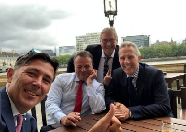 Ian Paisley (right) pictured with Arron Banks (second from left, with cigarette)