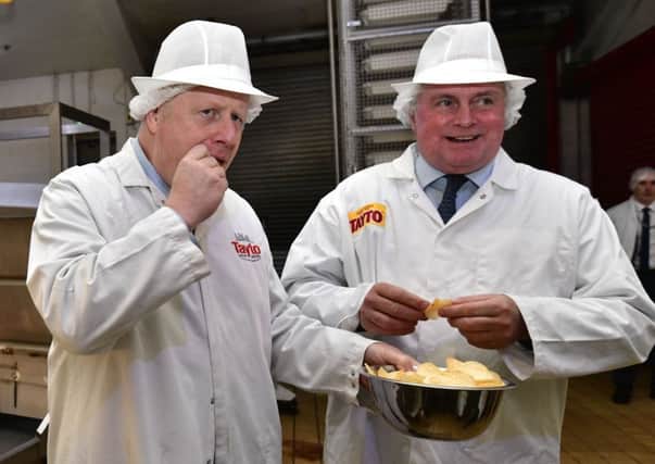 Prime Minister Boris Johnson sampled some of Northern Irelands favourite crisps during his visit to the Tayto factory in Tandragee