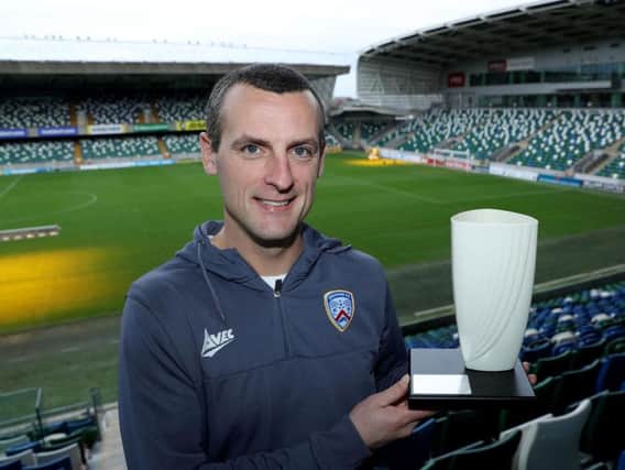 Coleraine manager Oran Kearney with the Belleek trophy