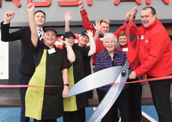 Jean McKinty has officially opened the new EUROSPARVictoria Road in Carrickfergus. Jean is pictured with, from left, Aidan McIvor, area manager, staff and Stephen Brown, store manager.