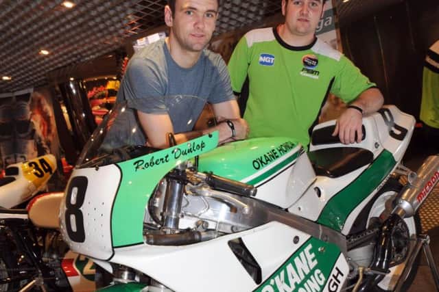 William and Michael Dunlop with their father Robert's Honda RC30 at the Macau Grand Prix in 2011. Picture: Stephen Davison/Pacemaker Press.