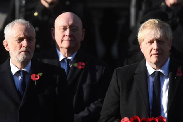 Labour party leader Jeremy Corbyn (left) and Prime Minister Boris Johnson during the Remembrance Sunday service at the Cenotaph memorial in Whitehall, central London